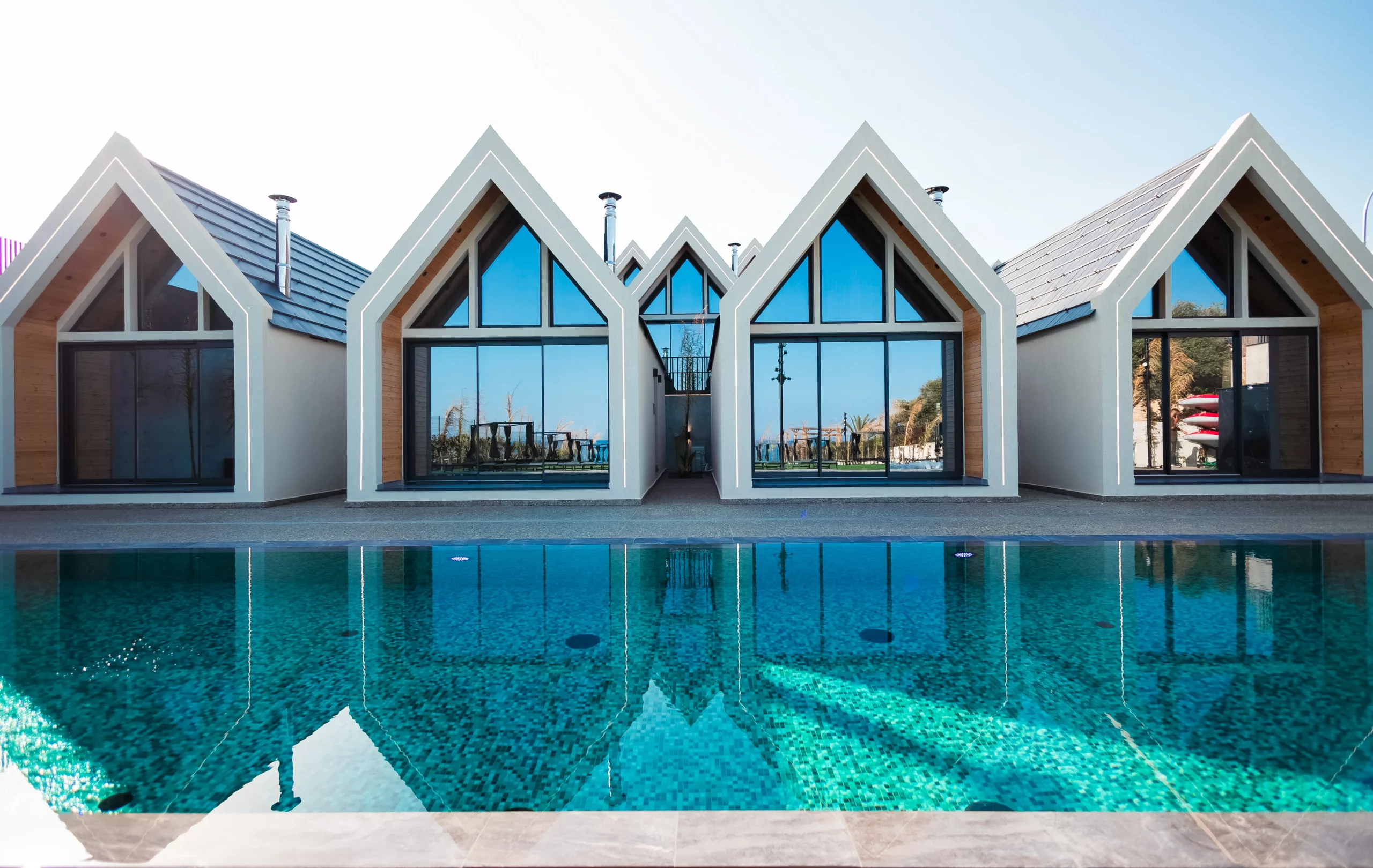 NOE Suites pool and expansive outdoor leisure area in Agios Theodoros, Cyprus