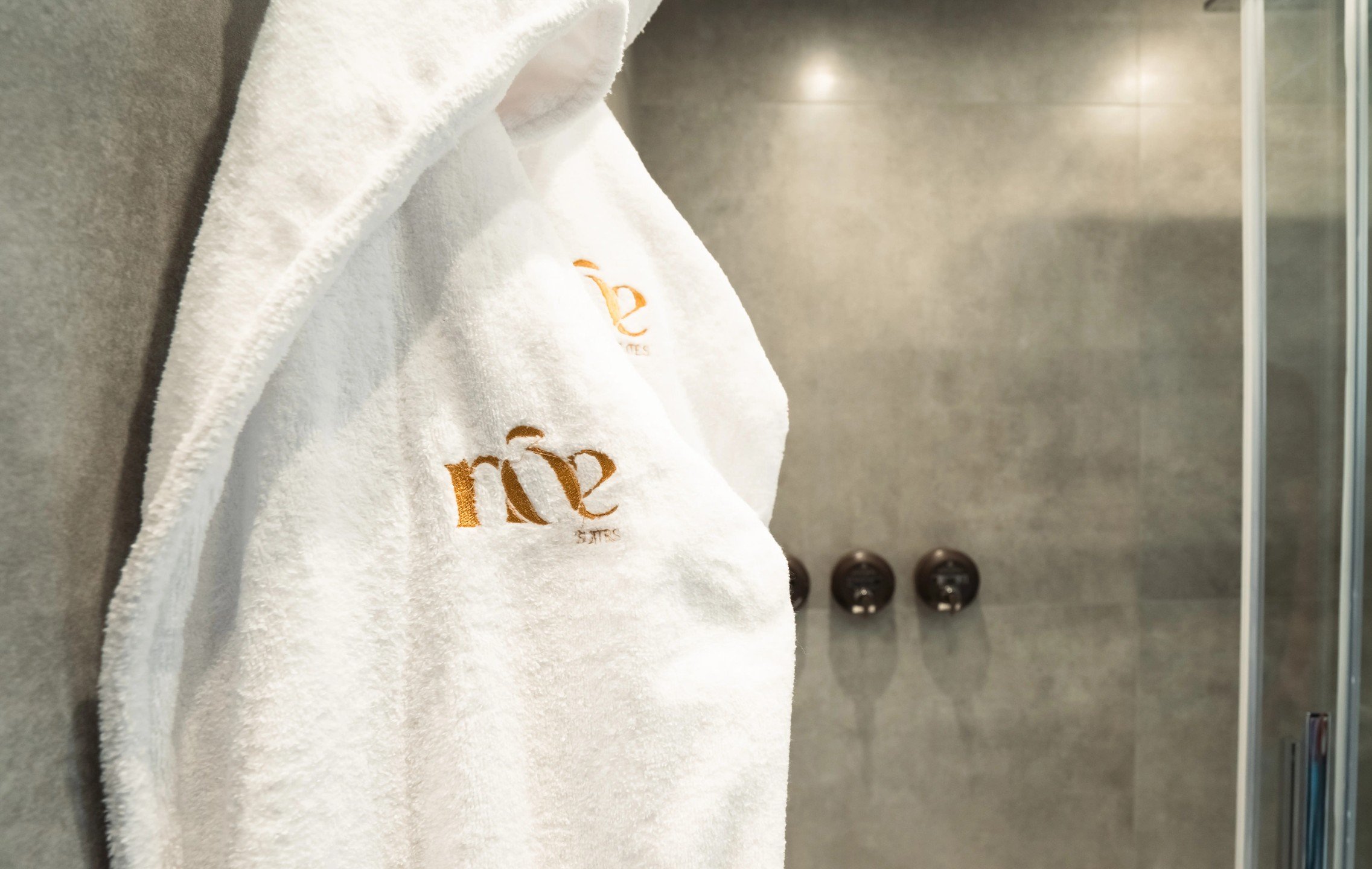 Bathrobes provided for guests at NOE Suites