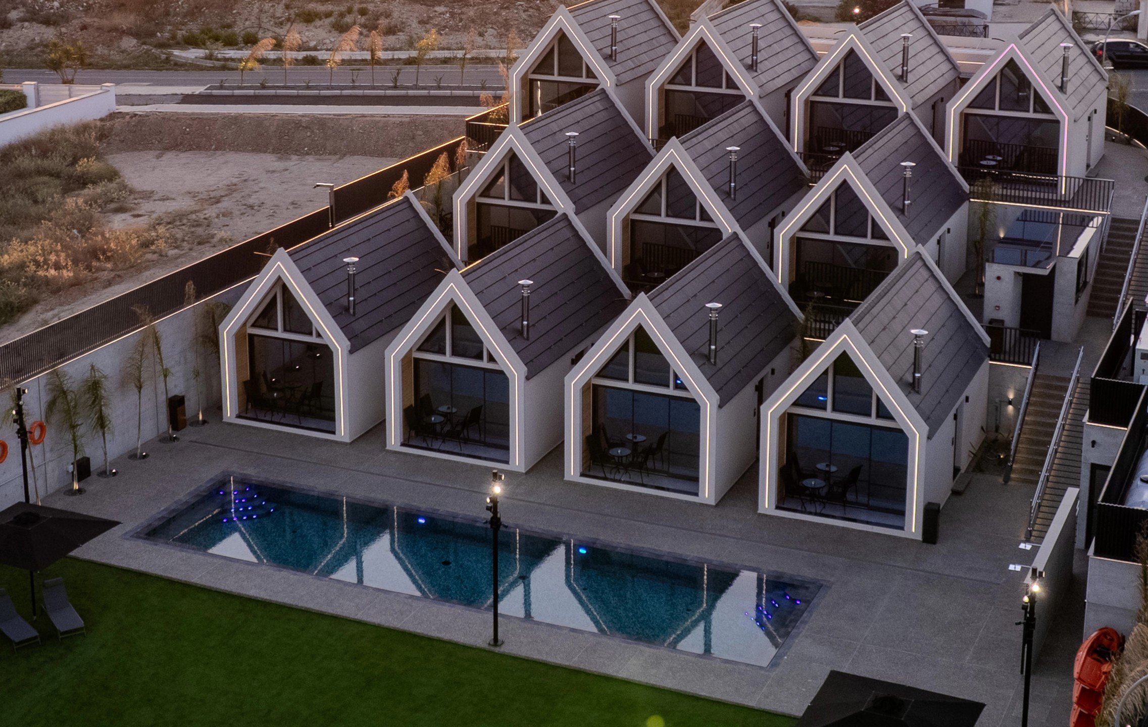 Aerial view of NOE Suites showing the shared pool and suites arranged across three levels