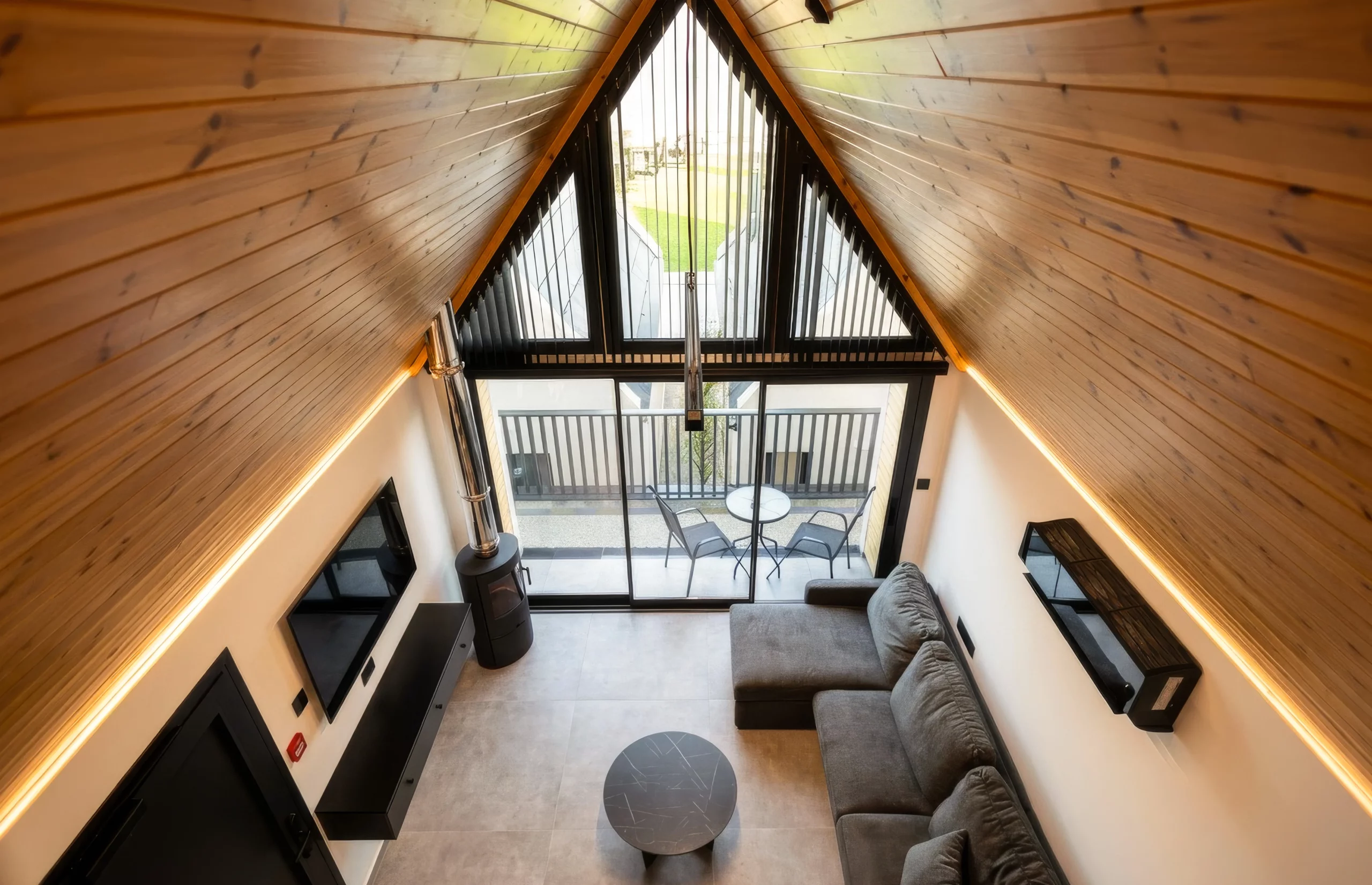 Open-plan NOE Suites interior viewed from the upper sleeping level