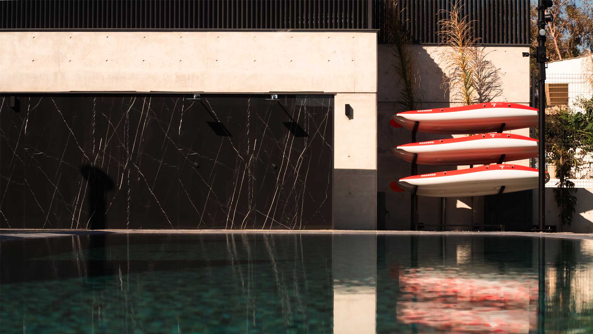Kayaks beside the swimming pool at NOE Suites in Agios Theodoros
